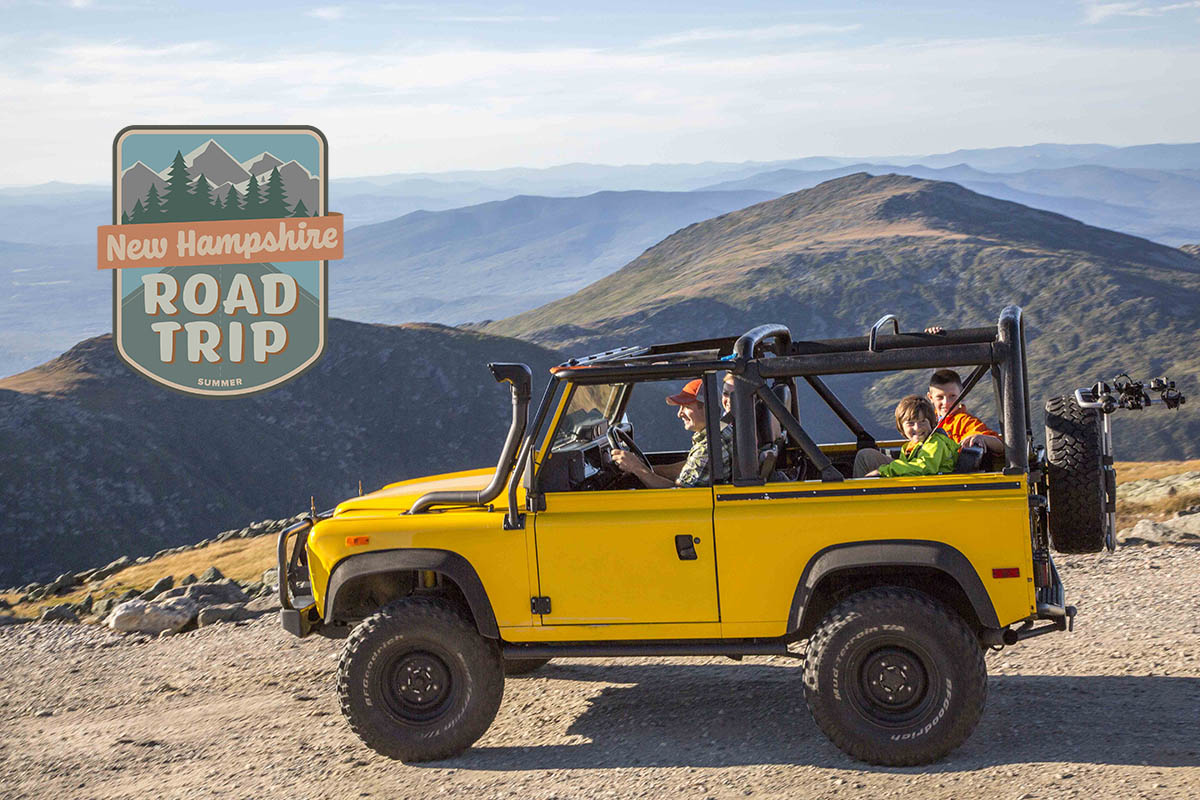 a yellow suv on a dirt road in the mountains with a graphic stating "Summer Road Trips."